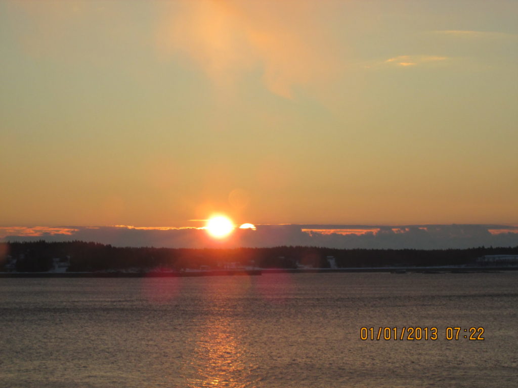 Sun rising over Campobello as seen from Eastport Maine