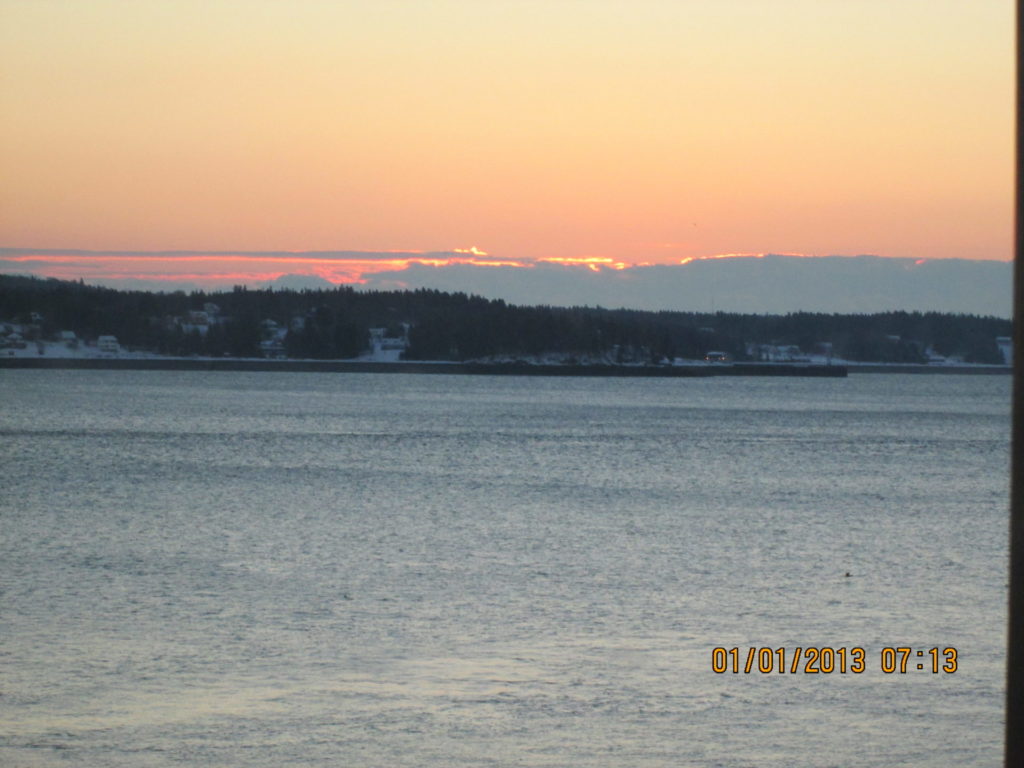 View of sun rising over Campobello seen from Eastport Maine
