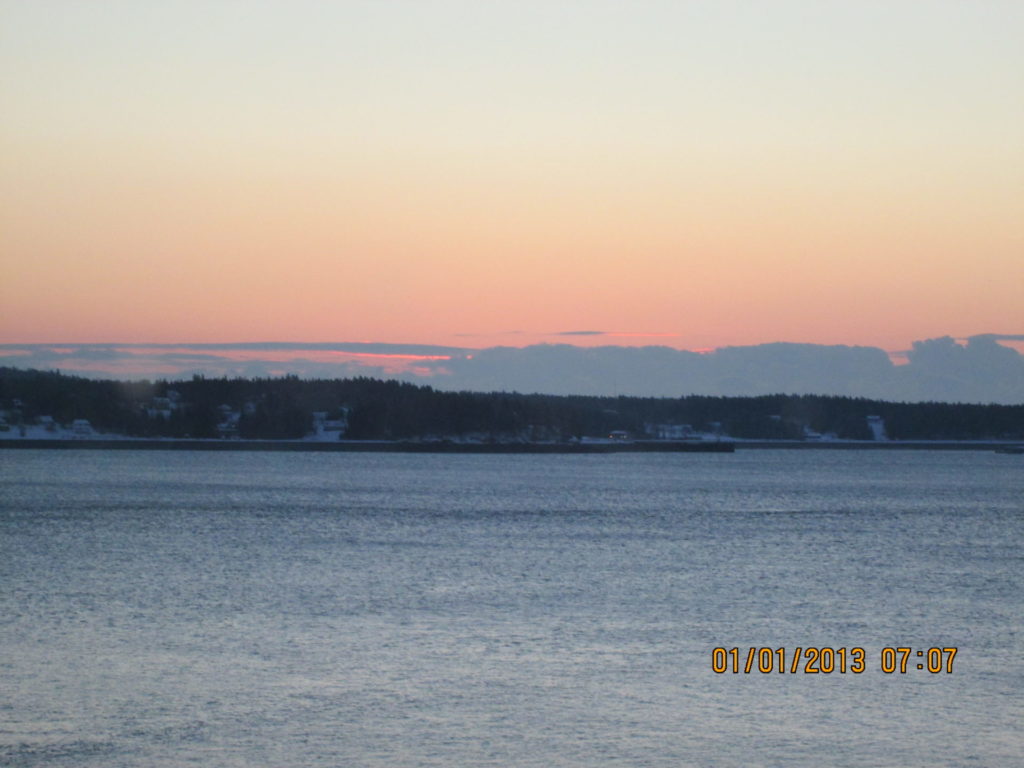 View of sun starting to rise over Campobello from Eastport Maine