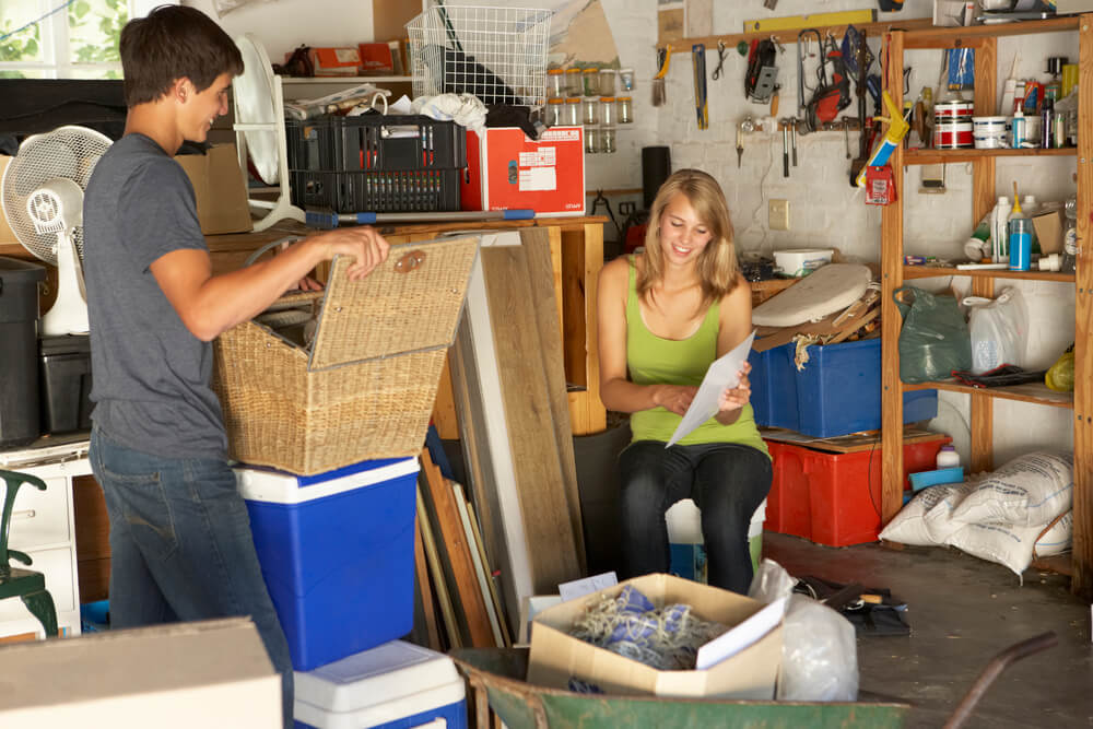 Couple in cluttered garage